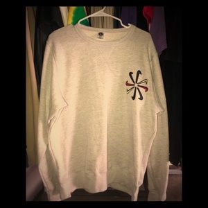 Salvaged Nike patches on sweater